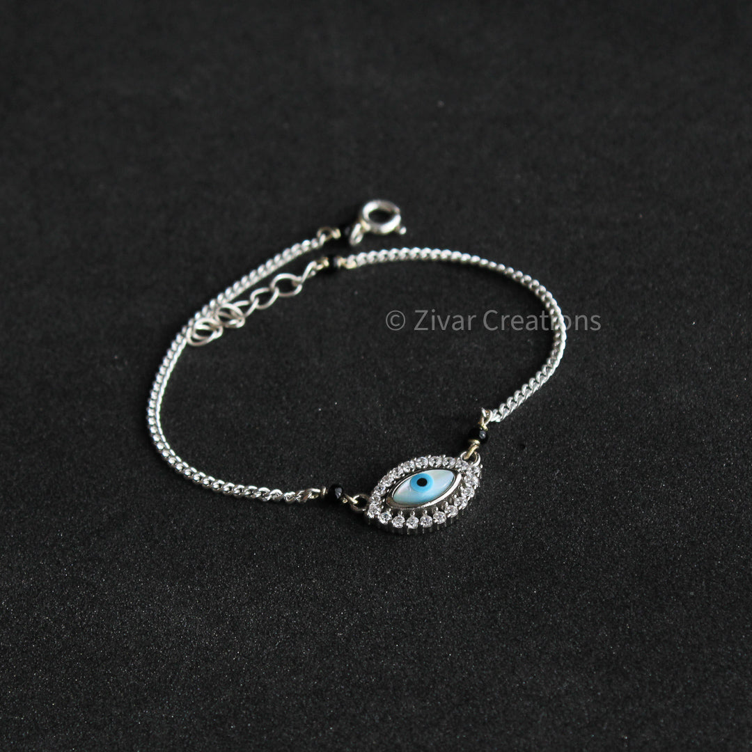 Silver Finish Evil Eye Bracelet In Sterling Silver Design by Eina Ahluwalia  at Pernia's Pop Up Shop 2024